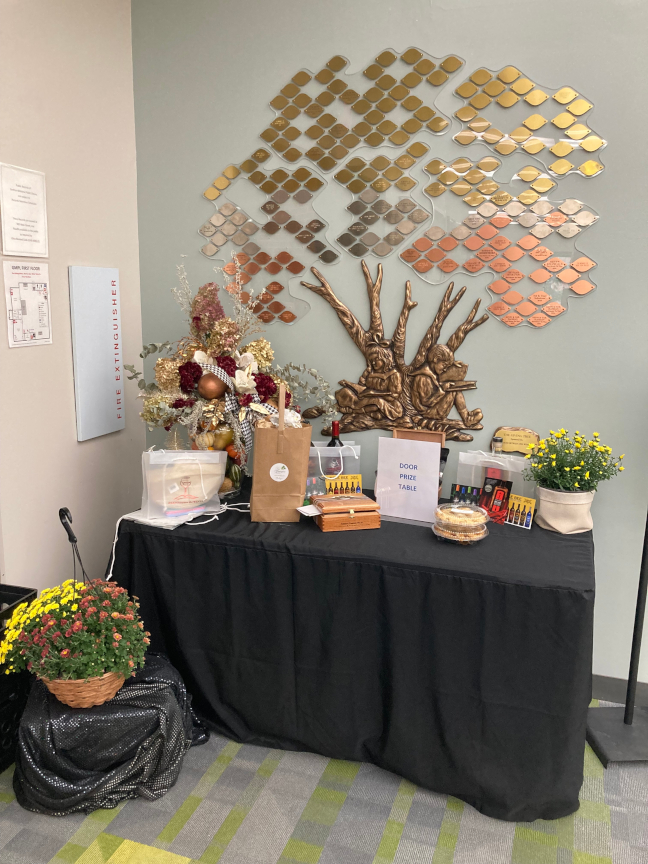 Vendors brought door prizes that were raffled off at the event. Here we see a photo of all those gifts which were located by the Endowment Tree.