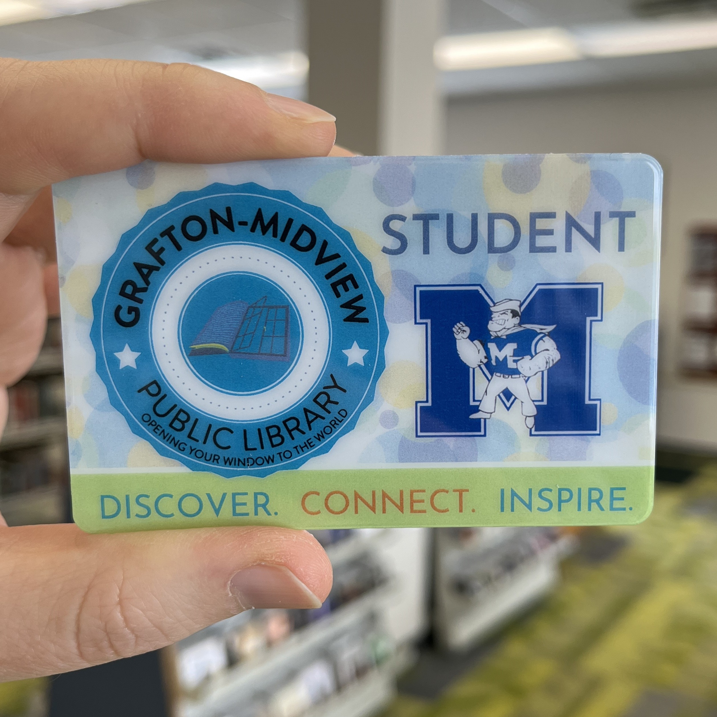 hand holding card inside the building